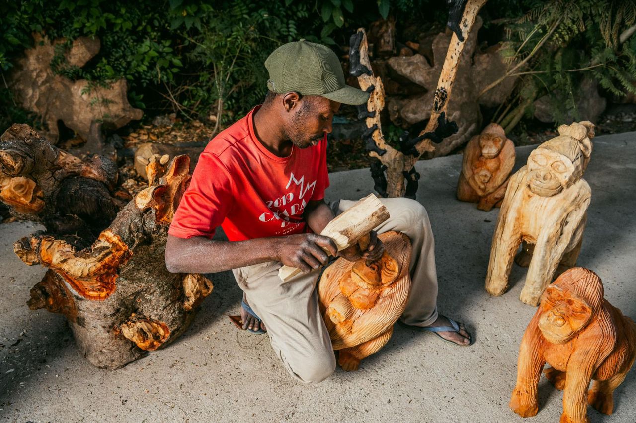 Finished gorilla carvings on display, each one hand-shaped and unique.